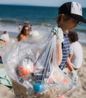 itisOVERDUE team cleaning up trash at a beach